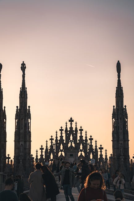 Sunset over Milan skyline with Duomo lit